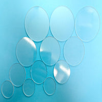 a group of glass circles on a blue background