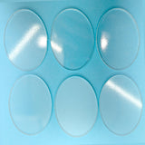 a close up of a plastic tray with four circles on it