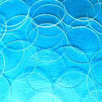 a close up of a blue background with circles