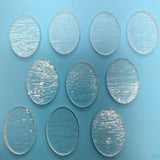 a group of round glass plates sitting on top of a table