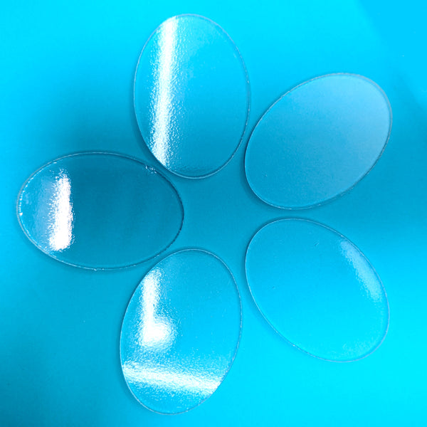 a group of pills sitting on top of a blue table